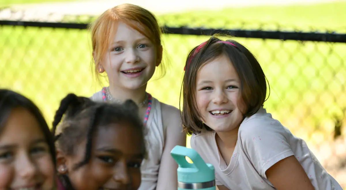 Five smiling children at a YMCA of Western North Carolina day camp.