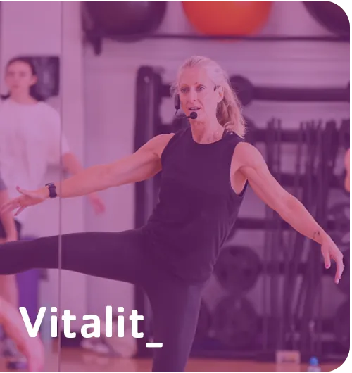 Vitality — an instructor leading a group fitness class at the Y.