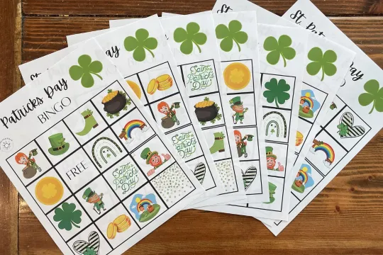 St. Patrick's Day Bingo cards lay on a table.