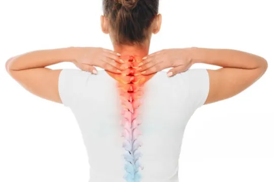 Highlighted spine showing back pain on woman.