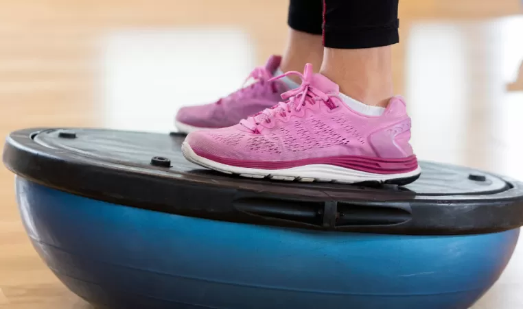A person using a stability ball during workout routine.
