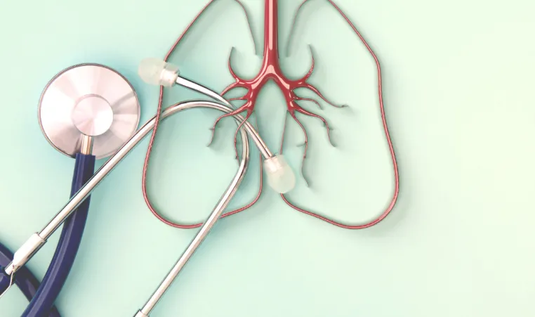 An abstract picture of a stethoscope next to a picture of a pair of lungs.