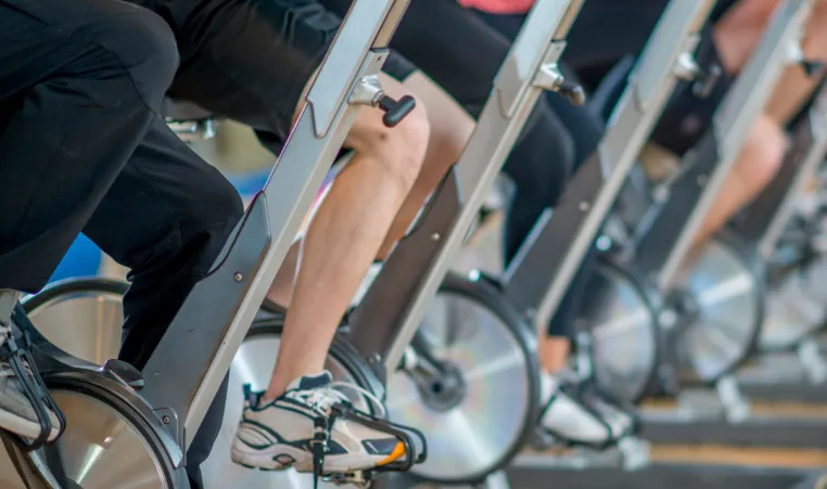 An indoor cycling class at a gym.