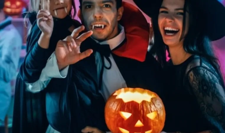 A family dresses up in Halloween costumes for a Monster Mash Dance party.