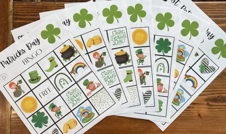 St. Patrick's Day Bingo cards lay on a table.