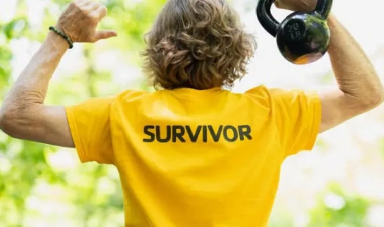 LIVESTRONG participant holds kettlebell.
