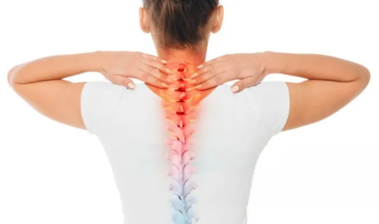 Highlighted spine showing back pain on woman.